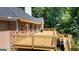 Wooden deck overlooks the backyard, complete with a stainless steel grill, perfect for outdoor entertaining at 401 Robinson Rd, Peachtree City, GA 30269