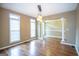 Elegant dining room with hardwood floors, large windows, and a stylish chandelier, perfect for entertaining at 401 Robinson Rd, Peachtree City, GA 30269