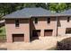 Exterior view of a brick home with a three-car garage at 401 Robinson Rd, Peachtree City, GA 30269