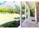 Inviting front porch with classic columns and a view of the sprawling lawn at 401 Robinson Rd, Peachtree City, GA 30269