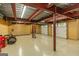 Large garage space with steel beams and multiple doors, perfect for a workshop or storage at 401 Robinson Rd, Peachtree City, GA 30269