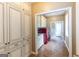Stylish laundry room with custom cabinets, granite countertops, and modern red washer and dryer at 401 Robinson Rd, Peachtree City, GA 30269