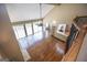 Open living room with hardwood floors, high ceilings, and access to the kitchen and backyard at 401 Robinson Rd, Peachtree City, GA 30269