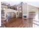 Expansive living room with a fireplace and lots of natural light from large windows at 401 Robinson Rd, Peachtree City, GA 30269