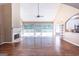 Well-lit living room with a fireplace and access to an outdoor deck at 401 Robinson Rd, Peachtree City, GA 30269