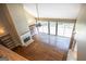 Bright living room with hardwood floors, fireplace, built-in shelves, and large windows overlooking the pool at 401 Robinson Rd, Peachtree City, GA 30269