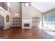 Bright living room with vaulted ceilings, fireplace, and sliding door to backyard at 401 Robinson Rd, Peachtree City, GA 30269