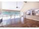 Sun-filled living room with fireplace, deck access, and adjoined kitchen at 401 Robinson Rd, Peachtree City, GA 30269