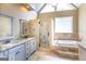 Elegant main bathroom featuring double vanity sinks, a glass shower, and a separate soaking tub at 401 Robinson Rd, Peachtree City, GA 30269