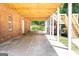 Spacious covered patio with brick accents, offering an ideal outdoor living and entertaining space at 401 Robinson Rd, Peachtree City, GA 30269