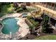Backyard pool with attached hot tub and a wooden deck at 401 Robinson Rd, Peachtree City, GA 30269