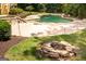 Backyard pool with a hot tub and a stone patio area at 401 Robinson Rd, Peachtree City, GA 30269
