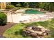 Backyard pool with a hot tub and a stone fire pit at 401 Robinson Rd, Peachtree City, GA 30269