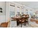 Dining room with hardwood floors, chandelier, and white curtains at 1110 Eagles Brooke Dr, Locust Grove, GA 30248