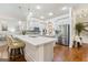 Modern kitchen with stainless steel appliances, white cabinetry, and hardwood floors at 1110 Eagles Brooke Dr, Locust Grove, GA 30248