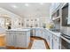 Stylish kitchen with stainless steel appliances, white cabinets, and hardwood floors at 1110 Eagles Brooke Dr, Locust Grove, GA 30248