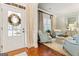 Inviting living room with hardwood floors, neutral tones, and natural light from the front door at 1110 Eagles Brooke Dr, Locust Grove, GA 30248