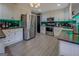 Spacious kitchen with stainless steel appliances and green tile backsplash at 2375 Gum Creek Rd, Oxford, GA 30054