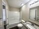 Clean bathroom featuring modern vanity with stone top and a shower-tub combo at 5743 Rock Rd, Union City, GA 30291