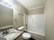 Clean bathroom with a granite-topped vanity and a shower-tub combination at 5743 Rock Rd, Union City, GA 30291