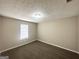 Comfortable bedroom with carpet, a window for natural light, and modern ceiling light at 5743 Rock Rd, Union City, GA 30291