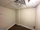 Small walk-in closet with tan walls and carpet at 5743 Rock Rd, Union City, GA 30291