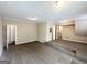 Spacious living room with carpet, neutral walls, and three steps leading to another room at 5743 Rock Rd, Union City, GA 30291