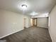 Carpeted living room with neutral walls and recessed lighting at 5743 Rock Rd, Union City, GA 30291