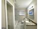 Updated bathroom with a tiled shower/tub, modern vanity, and stylish fixtures at 2310 Ousley Ct, Decatur, GA 30032
