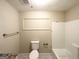 Cozy bathroom with new fixtures, including a tiled shower and modern toilet at 2310 Ousley Ct, Decatur, GA 30032