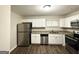 Modern kitchen featuring stainless steel appliances, granite countertops, and white cabinets at 2310 Ousley Ct, Decatur, GA 30032