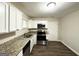 Well-lit kitchen featuring granite countertops and stainless steel appliances at 2310 Ousley Ct, Decatur, GA 30032