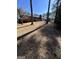 A sprawling backyard features mature trees, and ample space for outdoor activities at 1125 Carlo Sw Ct, South Fulton, GA 30331