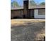 Backyard featuring a patio and lush greenery, with trees in the distance at 1125 Carlo Sw Ct, South Fulton, GA 30331
