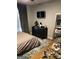 Modern bedroom with a large window, TV, and a large mirror at 1125 Carlo Sw Ct, South Fulton, GA 30331