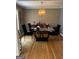 Traditional dining room with hardwood floors, a modern light fixture, and stylish decor at 1125 Carlo Sw Ct, South Fulton, GA 30331