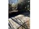 Well-maintained paved driveway, surrounded by mature trees and landscaping at 1125 Carlo Sw Ct, South Fulton, GA 30331