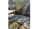 Paved driveway featuring mature trees and well-maintained landscaping at 1125 Carlo Sw Ct, South Fulton, GA 30331
