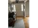 Welcoming entryway with hardwood floors and natural light coming through the front door at 1125 Carlo Sw Ct, South Fulton, GA 30331