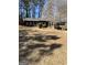 Charming single-story brick home with a spacious front yard, mature trees and manicured landscaping at 1125 Carlo Sw Ct, South Fulton, GA 30331
