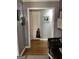 Neutral hallway showcases hardwood flooring and access to other rooms in the home at 1125 Carlo Sw Ct, South Fulton, GA 30331
