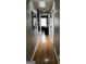 Hallway with hardwood floors, neutral walls, and stylish accents at 1125 Carlo Sw Ct, South Fulton, GA 30331