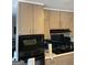 Classic kitchen with a black oven and microwave combo with lots of storage space at 1125 Carlo Sw Ct, South Fulton, GA 30331