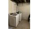 Convenient laundry room equipped with a modern washer and dryer, ensuring efficient laundry care at 1125 Carlo Sw Ct, South Fulton, GA 30331