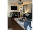Comfortable living room with a large flat screen TV, plush sofa, and stylish furnishings at 1125 Carlo Sw Ct, South Fulton, GA 30331