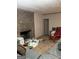 Cozy living room with brick fireplace, comfortable seating, and ample space for relaxation at 1125 Carlo Sw Ct, South Fulton, GA 30331
