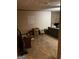 Spacious, unfinished living room featuring a brick fireplace and lots of potential at 1125 Carlo Sw Ct, South Fulton, GA 30331