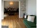 Inviting living room showcases wood floors, eclectic decor, and a view into the dining room at 1125 Carlo Sw Ct, South Fulton, GA 30331