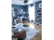 Inviting living room featuring a home office, hardwood floors, and natural light at 1125 Carlo Sw Ct, South Fulton, GA 30331