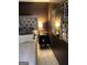 Elegant primary bedroom with a padded headboard and mirrored accents at 1125 Carlo Sw Ct, South Fulton, GA 30331